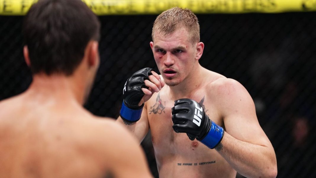 Ian Garry in the octagon with Shavkat Rakhmanov